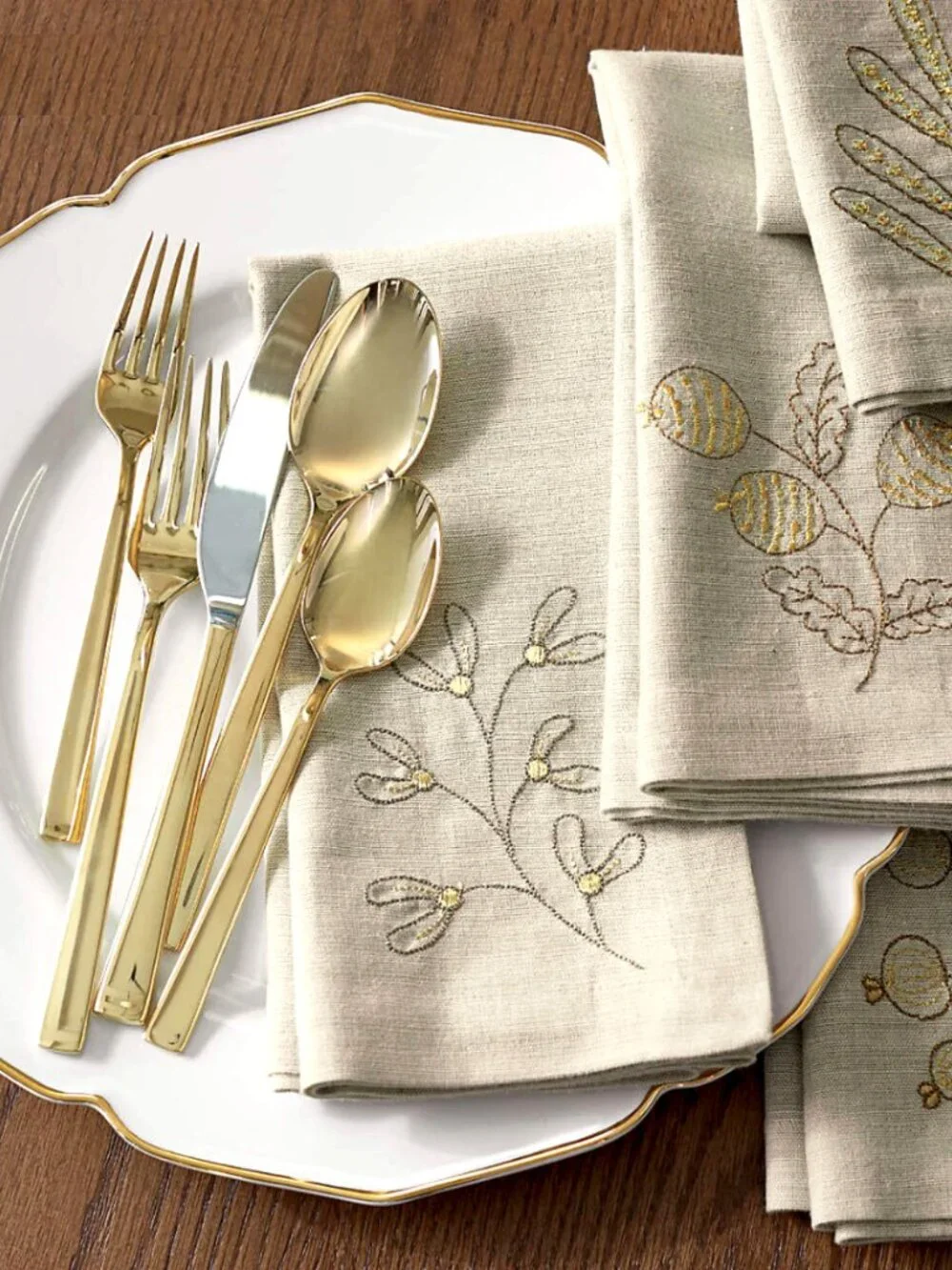 Crate&Barrel gold flatware “Ellenore” by Cambridge. 4 place settings, NIB.